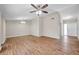 Well-lit living room featuring hardwood floors, a ceiling fan, and ample open space at 3246 Fox Lake Dr, Tampa, FL 33618