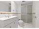 Bathroom featuring a white vanity, toilet, and a glass-enclosed shower at 330 Brandy Wine Dr # 330, Largo, FL 33771