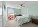Comfortable bedroom with a bed, dresser, and a light green paint at 330 Brandy Wine Dr # 330, Largo, FL 33771