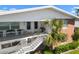 Inviting two-story condo building with brick accents, stair access, and manicured landscaping at 330 Brandy Wine Dr # 330, Largo, FL 33771