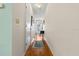Clean, bright hallway with wood flooring, neutral walls, and streamlined access to rooms at 330 Brandy Wine Dr # 330, Largo, FL 33771