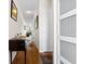 Neutral hallway with wood floors leads to living area, showcasing clean lines and storage at 330 Brandy Wine Dr # 330, Largo, FL 33771