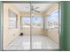 Sun room with white tile flooring, ceiling fan, and sliding glass doors at 330 Brandy Wine Dr # 330, Largo, FL 33771