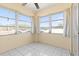 Bright sun room featuring white tile flooring and multiple windows for ample sunlight at 330 Brandy Wine Dr # 330, Largo, FL 33771