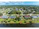 Wide shot of homes and community with lake access and mature trees at 3381 Conway Blvd, Port Charlotte, FL 33952