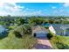 Captivating overhead view of a well-maintained home near a scenic lake at 3381 Conway Blvd, Port Charlotte, FL 33952