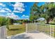 Relax on your patio with a view of the tranquil pond and a wooden dock, perfect for enjoying peaceful moments at 3381 Conway Blvd, Port Charlotte, FL 33952