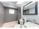 Updated bathroom with a tiled shower, modern vanity, and neutral colors with a functional layout at 3381 Conway Blvd, Port Charlotte, FL 33952