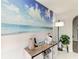 Charming coffee bar featuring a beautiful beach-themed mural and a modern floor lamp at 3381 Conway Blvd, Port Charlotte, FL 33952