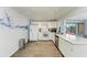 Bright kitchen with white cabinets, modern appliances, and a large window at 3381 Conway Blvd, Port Charlotte, FL 33952