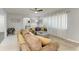 Bright living room features stylish decor, neutral paint, comfortable seating, and a ceiling fan at 3381 Conway Blvd, Port Charlotte, FL 33952