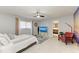 Comfortable main bedroom featuring a king bed, stylish decor, and ensuite bathroom access at 3381 Conway Blvd, Port Charlotte, FL 33952