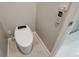 Modern toilet in a corner bathroom with wall-mounted remote control at 3553 Secluded Ct, Sarasota, FL 34240