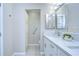 Bathroom featuring a single vanity with quartz countertop and a large storage cabinet at 37530 Corey Lewis Ave, Zephyrhills, FL 33541