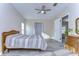 Bright bedroom with new floors, neutral walls, and convenient access to the doorway at 37530 Corey Lewis Ave, Zephyrhills, FL 33541
