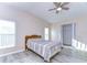 Bright bedroom with new floors, a ceiling fan, neutral walls, and a spacious closet at 37530 Corey Lewis Ave, Zephyrhills, FL 33541