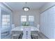 Bright dining area with updated lighting, flooring, and a closet at 37530 Corey Lewis Ave, Zephyrhills, FL 33541