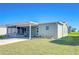 Well-kept home featuring a covered carport, neat landscaping, and an inviting screened-in porch at 37530 Corey Lewis Ave, Zephyrhills, FL 33541