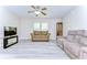 Cozy living room features new floors, neutral walls, and comfortable seating, perfect for relaxation at 37530 Corey Lewis Ave, Zephyrhills, FL 33541