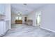 Spacious living room boasts new floors, neutral walls, and comfortable seating, perfect for relaxing at 37530 Corey Lewis Ave, Zephyrhills, FL 33541