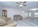 Inviting living room featuring new floors, neutral walls, and a well lit doorway at 37530 Corey Lewis Ave, Zephyrhills, FL 33541