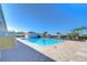 Community pool with blue water, deck chairs, and surrounding landscaping offering a relaxing outdoor space at 37530 Corey Lewis Ave, Zephyrhills, FL 33541