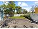 This spacious backyard features a concrete slab and white vinyl fencing for privacy and security at 4750 Burlington N Ave, St Petersburg, FL 33713