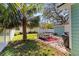 Outdoor patio area featuring comfortable seating, a grill, and lush green lawn at 4750 Burlington N Ave, St Petersburg, FL 33713