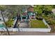 Aerial view of a fenced backyard, detached garage and a patio with outdoor seating at 4750 Burlington N Ave, St Petersburg, FL 33713