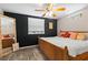 Bedroom featuring a rustic wood bed frame, wood floors, and neutral walls at 4750 Burlington N Ave, St Petersburg, FL 33713