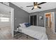 Bedroom featuring wood-look floors, ample light, and ensuite access at 4750 Burlington N Ave, St Petersburg, FL 33713