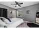 Bedroom featuring neutral colors, a ceiling fan, and a bright window at 4750 Burlington N Ave, St Petersburg, FL 33713