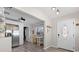 Bright entryway featuring wood floors, a stylish door, and an adjacent kitchen area at 4750 Burlington N Ave, St Petersburg, FL 33713