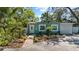 Charming curb appeal with a freshly painted home, brick pathway, and lush tropical landscaping at 4750 Burlington N Ave, St Petersburg, FL 33713
