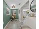 Cozy hallway featuring a unique hanging chair, stylish decor, and natural light at 4750 Burlington N Ave, St Petersburg, FL 33713