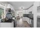 Modern kitchen with stainless steel appliances, granite counters, and views to living space at 4750 Burlington N Ave, St Petersburg, FL 33713
