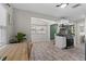 Bright kitchen featuring wood-look floors, white cabinets, and modern appliances at 4750 Burlington N Ave, St Petersburg, FL 33713