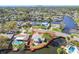 Aerial view showcasing the canal-front property with clear property lines surrounded by neighborhood and waterways at 5167 Venetian Ne Blvd, St Petersburg, FL 33703