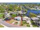 Aerial view showcasing the property with clear property lines surrounded by neighborhood and waterways at 5167 Venetian Ne Blvd, St Petersburg, FL 33703