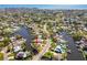 Aerial view showcasing the property nestled in a community with access to canals and waterways at 5167 Venetian Ne Blvd, St Petersburg, FL 33703