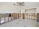 Bright bedroom featuring Terrazzo flooring, closet storage, and neutral interiors at 5167 Venetian Ne Blvd, St Petersburg, FL 33703