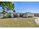 Charming single-story home with a well-maintained lawn and mature landscaping at 5167 Venetian Ne Blvd, St Petersburg, FL 33703