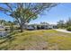 Quaint home with lush lawn, mature trees and canal front living at 5167 Venetian Ne Blvd, St Petersburg, FL 33703
