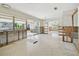 Bright, open living area with large windows and glass sliding doors, leading to outdoor spaces at 5167 Venetian Ne Blvd, St Petersburg, FL 33703