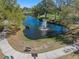 Scenic pond with a fountain, surrounded by lush greenery, trees, and sidewalks at 5509 18Th S Ave, Gulfport, FL 33707