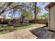 Spacious backyard with patio, play set and mature trees providing shade and a perfect place to relax at 592 Deer W Run, Palm Harbor, FL 34684