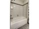 This bathroom showcases a bathtub with tiled surround and mounted shower head at 592 Deer W Run, Palm Harbor, FL 34684