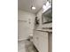 Bathroom featuring granite vanity, tiled floors, modern decor, and updated lighting at 592 Deer W Run, Palm Harbor, FL 34684