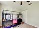Neutral bedroom with a loft bed, ceiling fan, carpeted floors, and closet at 592 Deer W Run, Palm Harbor, FL 34684