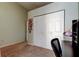 This bedroom features a large closet for ample storage and a desk at 592 Deer W Run, Palm Harbor, FL 34684